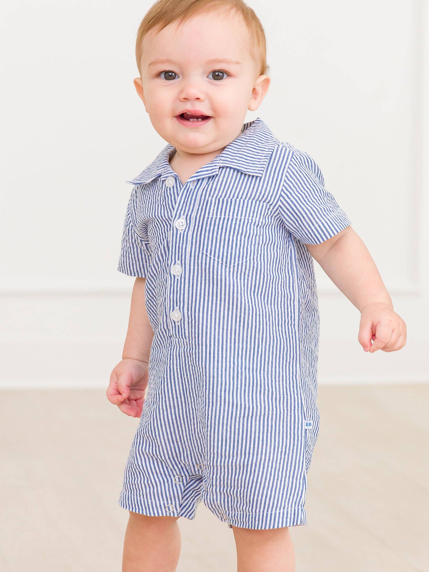 RuffleButts + RuggedButts - Baby Boys Blue Seersucker Button-Up Romper